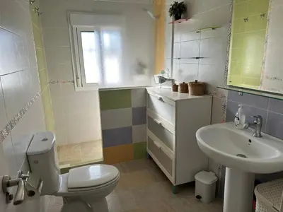 a bathroom with a toilet and a sink at Casa Sampalo in Cádiz