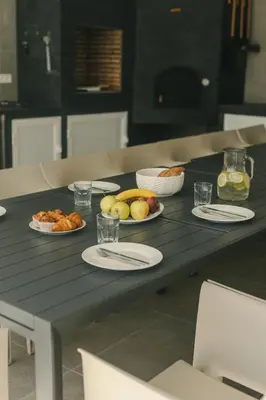 a table with plates of food and fruit on it at Alda & Aljosía in Chiclana de la Frontera