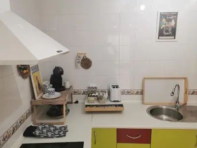 a kitchen with a sink and a counter top at Apartamento Pirrado in Sanlúcar de Barrameda