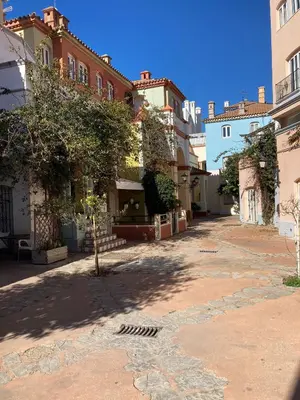 an empty street in a city with buildings at Apartamento Peña de Hita in El Puerto de Santa María