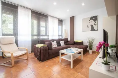 a living room with a couch and a table at Apartamento El descanso de Julia Augusta - Cadiz in Cádiz