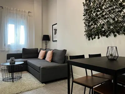 a living room with a couch and a table at Kadis-Korazon Grupo AC Gestion in Cádiz