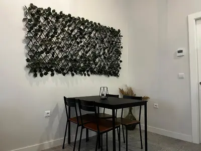 a black table and chairs in a room at Kadis-Korazon Grupo AC Gestion in Cádiz