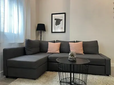 a living room with a couch and a table at Kadis-Korazon Grupo AC Gestion in Cádiz