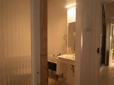 a bathroom with a sink and a mirror at Botánico Casa Rural in Arcos de la Frontera