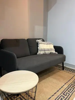 a living room with a couch and a table at Villa Zeus in Rota