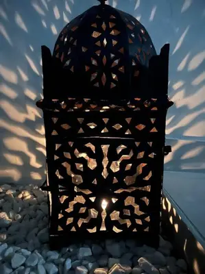 a lantern sitting on top of a pile of rocks at Villa Zeus in Rota