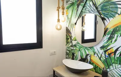 a bathroom with a sink and a mirror at Elcano Village by Sanlucar Housing in Sanlúcar de Barrameda