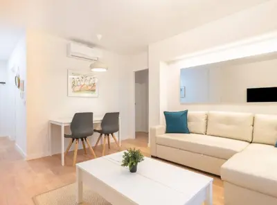 a living room with a couch and a table at Apartoyou - Plaza de Toros in El Puerto de Santa María