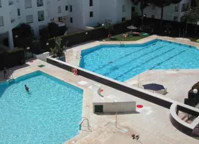 an overhead view of a large swimming pool at Apartamento en Puerto de Santa María, Playa Las Redes in El Puerto de Santa María