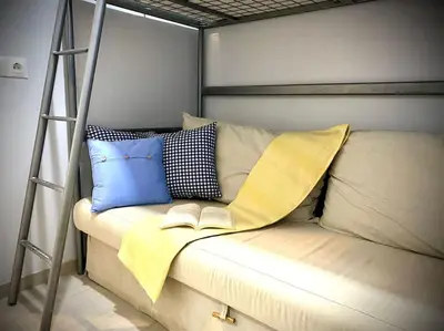 a bunk bed with pillows and a book on it at MyChoice Toledo in Rota