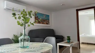 a vase on a table in a living room at Luz Baal Grupo AC Gestion in Cádiz