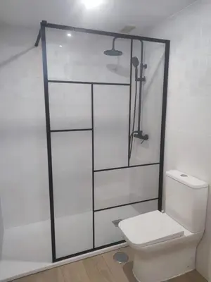 a bathroom with a toilet and a glass shower stall at APARTAMENTOS LUZ DE LA BAHÍA SUR CADIZ San Fernando in San Fernando