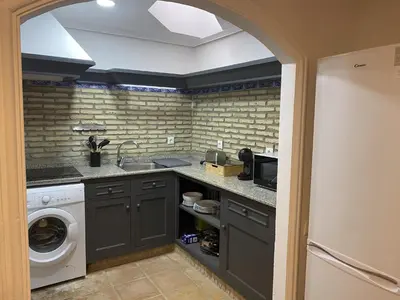 a kitchen with a sink and a washing machine at APARTAMENTOS LUZ DE LA BAHÍA SUR CADIZ San Fernando in San Fernando