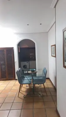 a dining room with a table and two chairs at APARTAMENTOS LUZ DE LA BAHÍA SUR CADIZ San Fernando in San Fernando