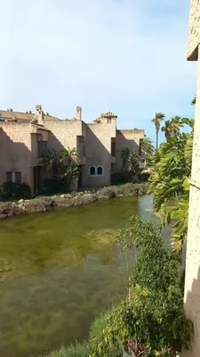 a river in front of a building at APARTAMENTOS LUZ DE LA BAHÍA SUR CADIZ San Fernando in San Fernando