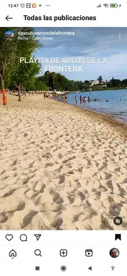 a screenshot of a beach with people in the water at Charming apartment in Arcos de la Frontera, 70 m² with balcony in Arcos de la Frontera