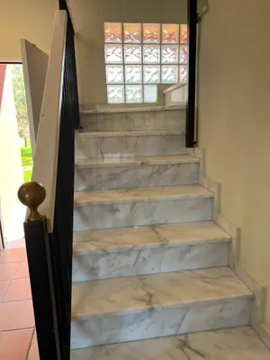 a set of stairs leading up to a house at Casa piscina playa Barrosa Delfin 7 in Chiclana de la Frontera
