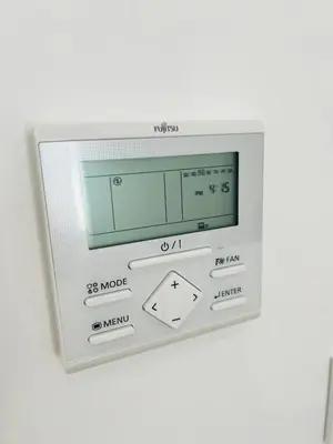 a microwave oven on a white wall at Villa Horacia - Playa de la Jara con Piscina in Sanlúcar de Barrameda