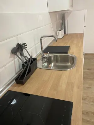 a kitchen counter with a stainless steel sink at Apartamento La Saeta in Jerez de la Frontera