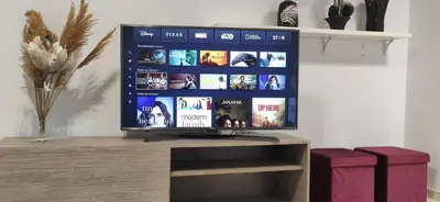 a flat screen tv sitting on top of a wooden stand at JT CHICLANA, ,Parking, Aire, Wifi, TV, Terraza in Chiclana de la Frontera
