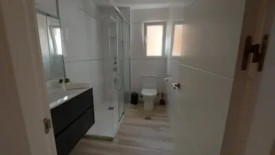 a bathroom with a shower and a sink and a toilet at LA VICTORIA in Cádiz
