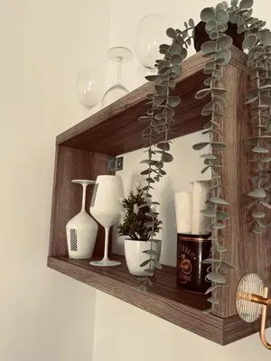 a wooden shelf with vases and vases on it at Loft céntrico con gran terraza in El Puerto de Santa María