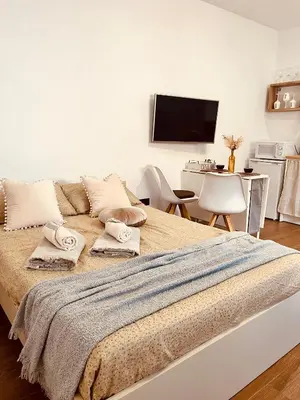 a bedroom with a bed with two pillows on it at Loft céntrico con gran terraza in El Puerto de Santa María