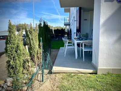 a balcony of a house with a table and chairs at MyChoice Terraces in Rota