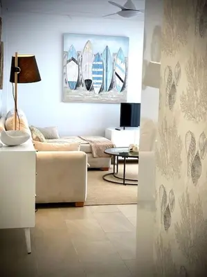 a living room with a couch and a table at MyChoice Terraces in Rota