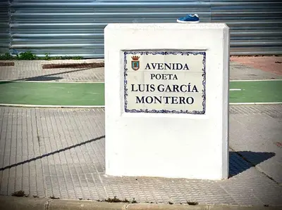 a white sign on the side of a street at MyChoice Terraces in Rota