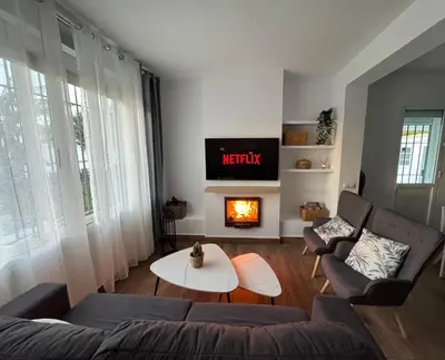 a living room with a couch and a fire place at Villa Armonía in Arcos de la Frontera