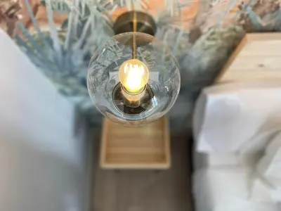 a glass lamp with a candle in a room at Skyline - Loft with private terrace and breathtaking views! in Cádiz
