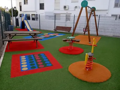 a playground with a picnic table and a swing at Villa Mar in Chiclana de la Frontera