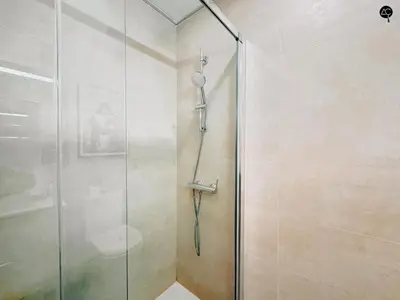 a shower with a glass door in a bathroom at El Encanto de la Playa Santa Mª Grupo AC Gestion in Cádiz