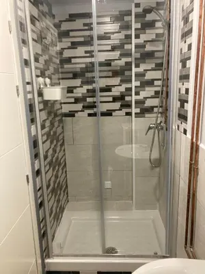 a shower with a glass door in a bathroom at Villa Mutt in Jerez de la Frontera