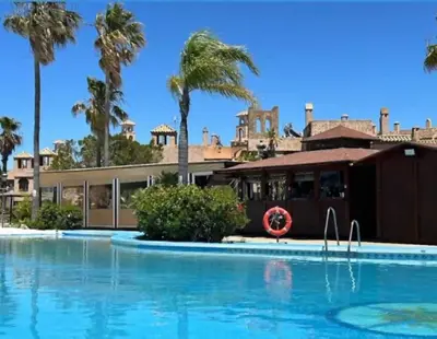 an aerial view of a resort with two swimming pools at Sonsoles Apartamentos Bahía Sur in San Fernando
