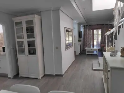 a living room with a couch and a glass table at Sonsoles Apartamentos Bahía Sur in San Fernando