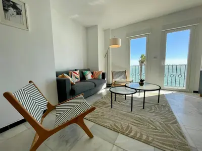 a living room with a couch and a table at GATU Villa Océano frente al mar en Puerto Sherry 