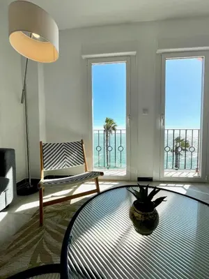 a living room with a view of the ocean at GATU Villa Océano frente al mar en Puerto Sherry 