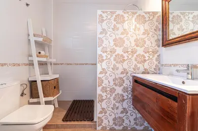 a bathroom with a sink and a toilet and a shower at Top Ático Estudio Sur - Terraza in Jerez de la Frontera