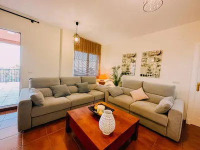 a living room with two couches and a coffee table at Mika's House Pool in Sanlúcar de Barrameda