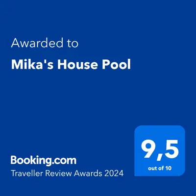a blue text box with the words awarded to milkas house pool at Mika's House Pool in Sanlúcar de Barrameda