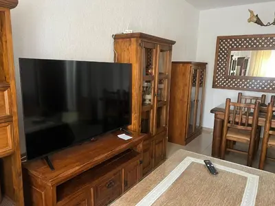 a large flat screen television in a living room at Casa Inés in Sanlúcar de Barrameda