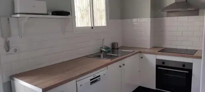 a kitchen with a sink and a counter top at La Playita Santa María Beach in Cádiz