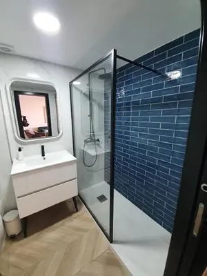 a bathroom with a sink and a shower with a mirror at Mirador de Sanlucar 9 in Sanlúcar de Barrameda