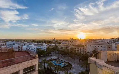 a view of a city at sunset at New York Style Luxury 3 dormitorios in Jerez de la Frontera
