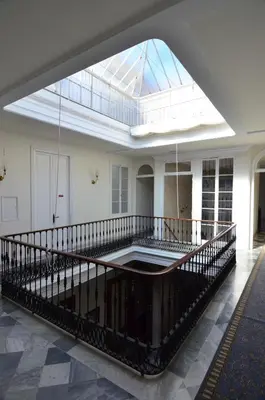 a large room with a skylight in a building at Nuevo Hotel in Jerez de la Frontera