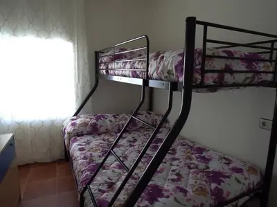a couple of bunk beds in a room at Casa Rural Dehesa de Algar in Algar