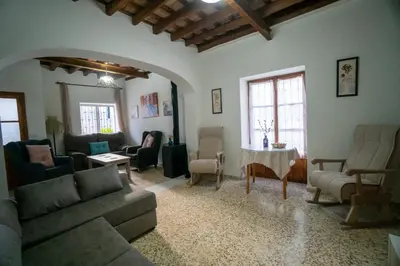 a living room with a couch and chairs and a table at Casa Rural Dehesa de Algar in Algar